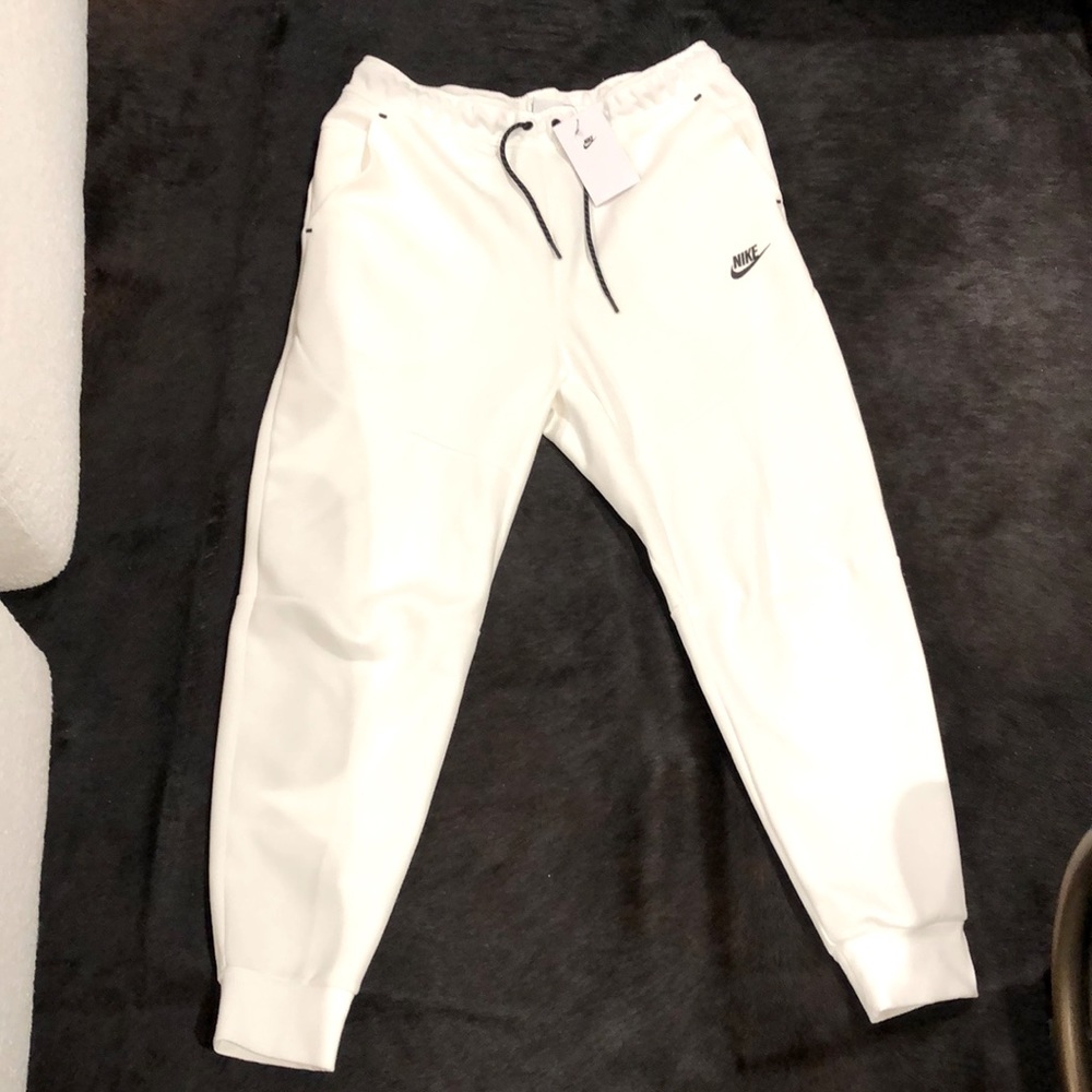 White, tapered leg, Nike joggers.